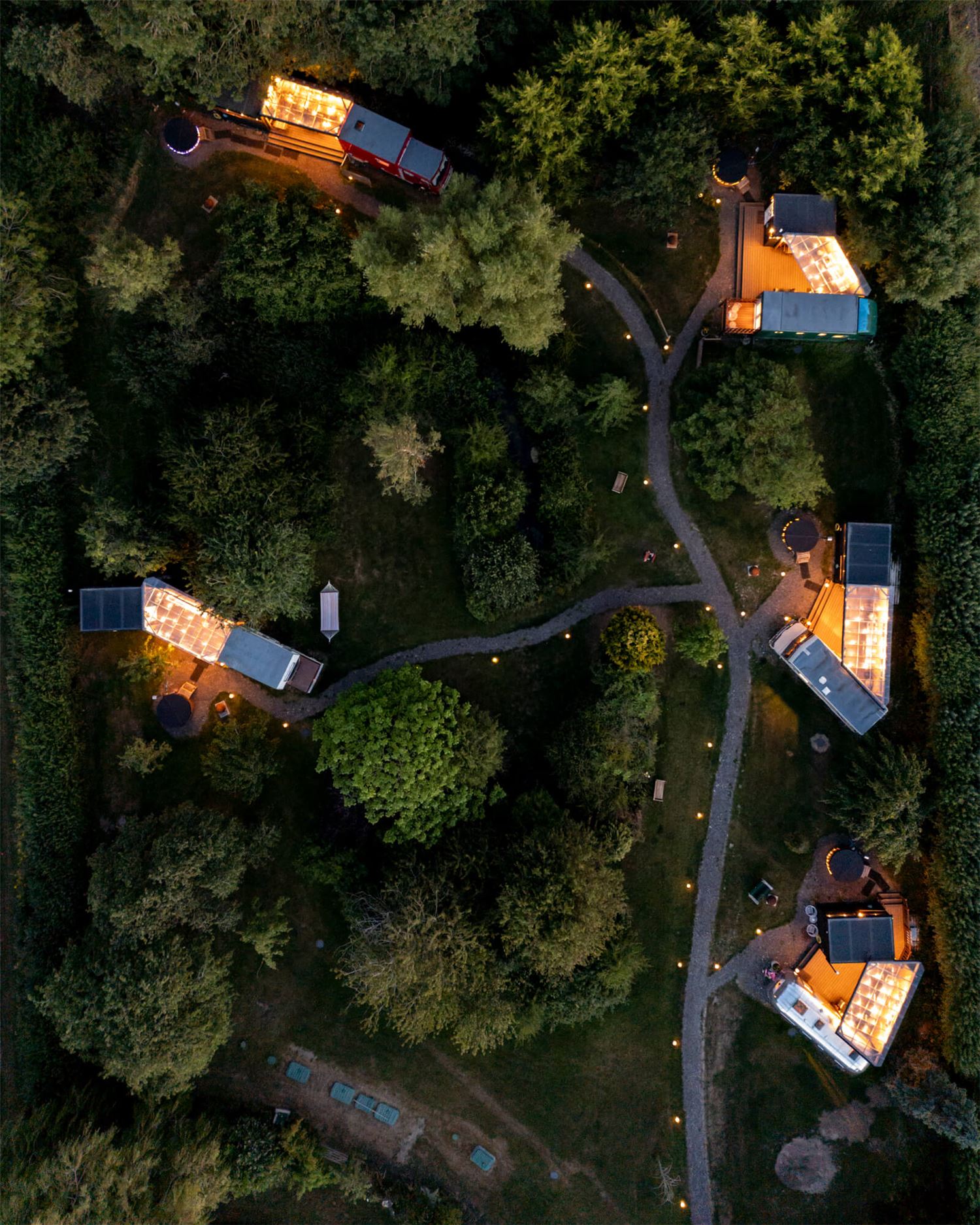 Overhead shot of the site showing the vehicles, decks, bathrooms and hot tubs.