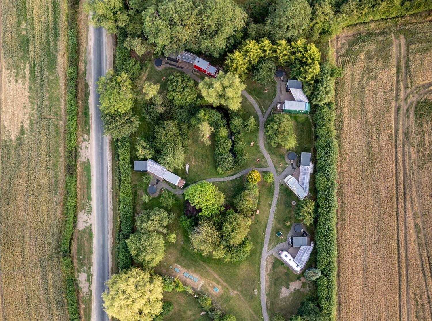 Overhead shot of the site showing the vehicles, decks, bathrooms and hot tubs.